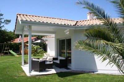 Terrasse couverte construction maison RT 2012 Les Mas d'Arguin